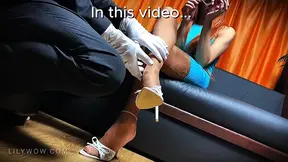 LilyWOW provides a sensual foot massage to her obedient servant while