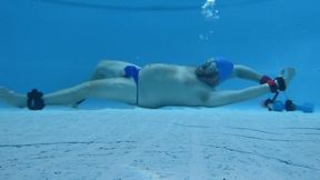 Blue thong and swim cap underwater bondage