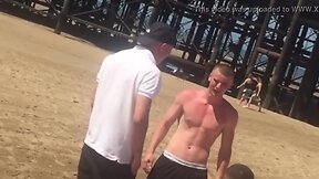 Excited shirtless dude adjusts his bulge in front of his friends