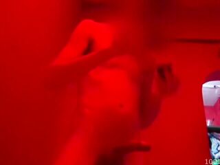 Interracial sex filmed in a dimly lit bordel