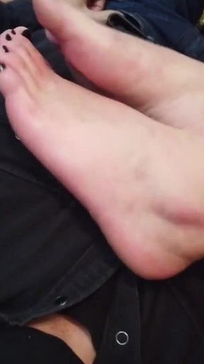 Worshiping the feet of a tattooed gothic lady