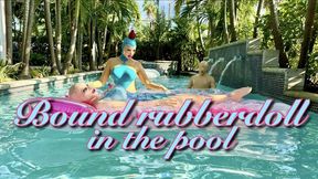 Bound rubberdoll in the pool