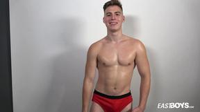 ”Muscle boy Jonathan Hicks shows his abs”