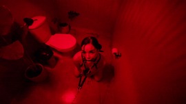 Couple get it on while in a bathroom with red lighting