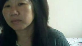 Elegant Chinese MILF flashes her titties for money on webcam