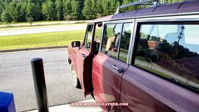 Jane Domino Gassing Up the '86 Jeep Grand Wagoneer in USA Tank Top, Black Daisy Dukes & White Scrunch Knee High Boots