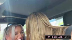 Blonde bombshells kissing and eating pussy in the back seat of a car