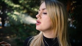 Hot Blonde Babe Smoking One Black Cigarettes in Nature