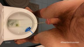 Hairy guy taking a long piss in slomo