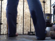 Desperate pee in jeans on the balcony