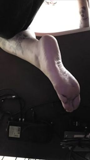 POV: bored goth girl ignores pathetic footboy beneath her feet