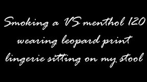 Sitting on a stool smoking in lingerie
