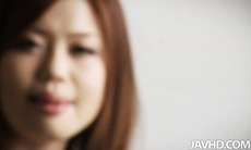 Bored Nao is on a blue chair playing with her sweet pussy and showing off her ripe ass to the cameras.