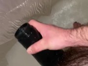 Young hairy daddy plays with flashlight in shower