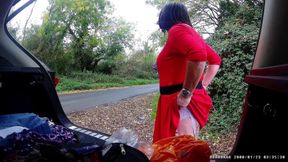 Just getting changed parked at side of road with cars driving past