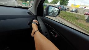 Stepmom in short skirt and heels with sexy legs rubs her pussy in the car in public and teases her stepson