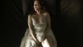 Retro mature lady pulls up her fluffy white dress and enjoys stroking pussy
