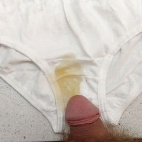 Rubbing myself on cute white panties then peeing on them a little