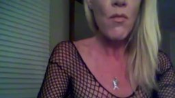 Older Blonde in Fishnet Teases