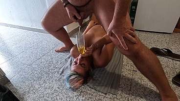 Wife lying on her back drinking piss & cum through a funnel