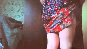Lovely sissy adjusting garter belt with cheeky grin