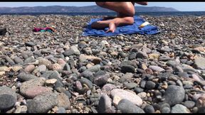 Cute exhibitionist girl get naked in public beach