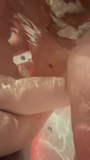 rubbing while my girlfriend gives me a handjob in a Jacuzzi