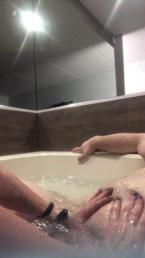 Flab fun in a jacuzzi! Slim n sexy Rachel Wriggler has slippy sliding soapy fun with a big chubby bear