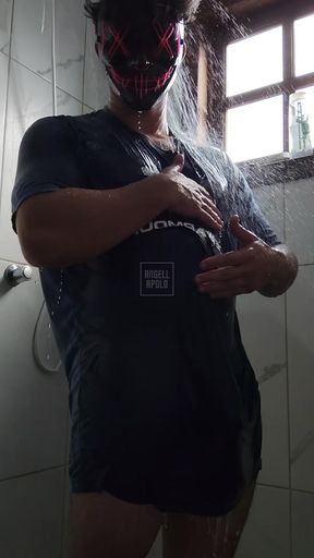 Tattooed masked man takes a shower alone and fucks his toy until he cums