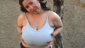 Chubby brunette milf plays with her big natural tits outdoors