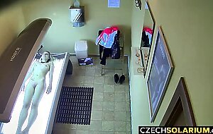Blonde girl caught in public solarium,