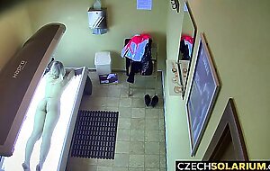 Blonde girl caught in public solarium,