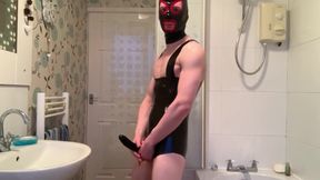 Bisexual gimp boy teases latex fetish cock sheath alone