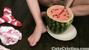”Adorable Christina squashing watermelon”