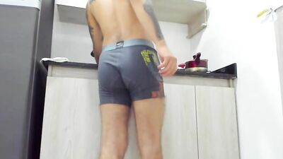 Amateur bloke is having fun in his soli performance inside the kitchen