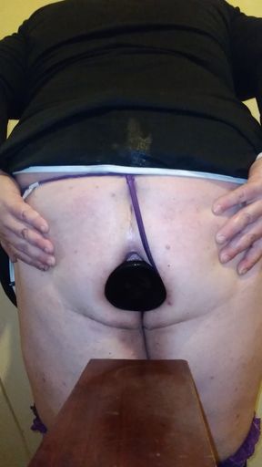 Fat ass sissy sits on even bigger butt plug &quot;the keg&quot;