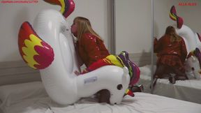 Alla inflates an inflatable unicorn with her mouth and fucks it hard and wears a shiny down jacket