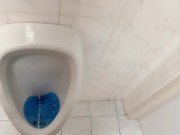 Peeing and moaning after pee desperation at the public urinal