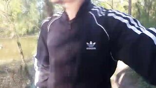 Who will spot this twunk in a black-and-white Adidas tracksuit, demonstrating his fuck-stick in public—going commando—and pissing into the sea?
