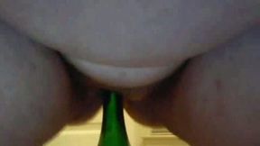 This obese mature lady rides a bottle on the webcam