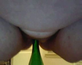 This obese mature lady rides a bottle on the webcam