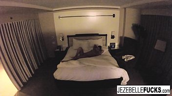 Sexy Jezebelle Bond hangs out in her hotel room