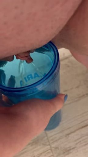 Peeing into a cup