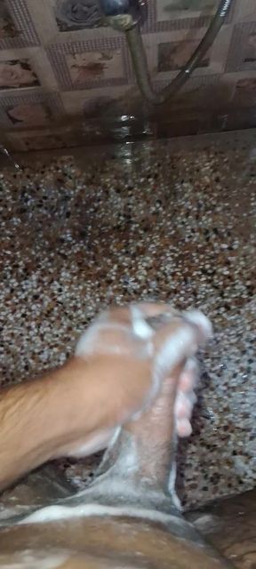 A Young Hindu Boy From India Is Fucking His Thick Cock Hard with His Hands While Taking a Bath