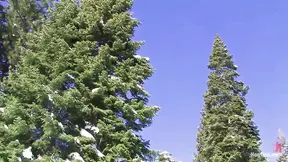 Slim Tahoe gives a sloppy blowjob to her muscular mountain man outdoors