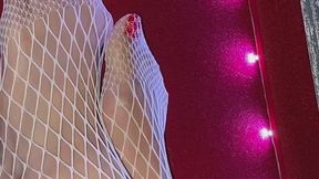 Melove with her red nail polish wearing white fishnets