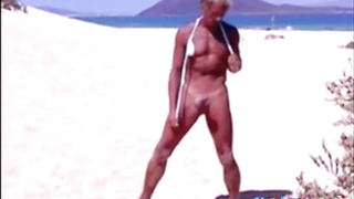 Tanned guy on beach in tiny string thong (temporarily!) 8