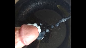 Cumshot on black plate