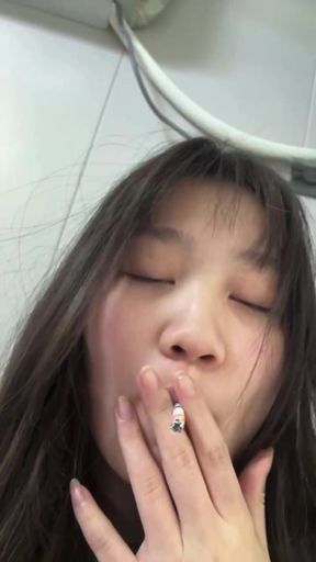 Smoking woman in studio