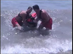 Guy get his thick cock sucked by two lifeguards at same time